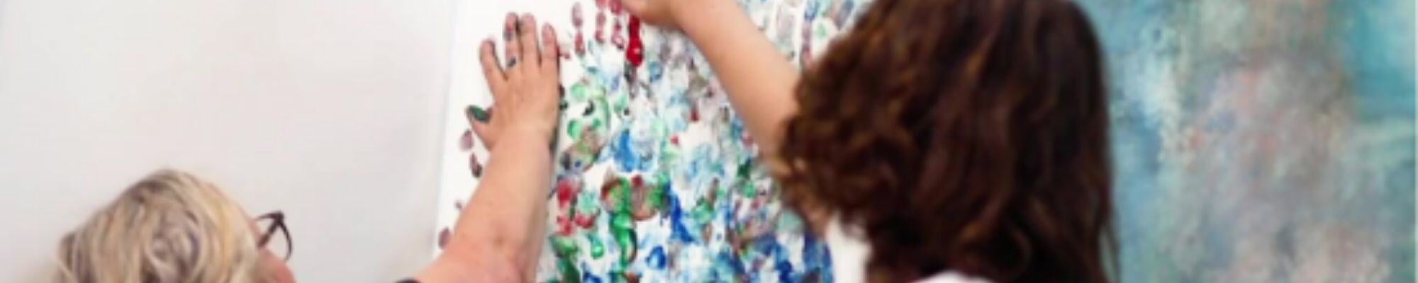 Mum and son painting with hands