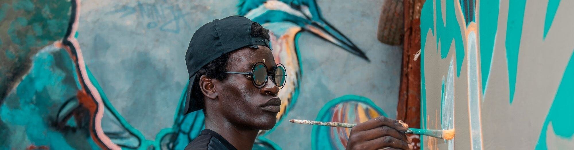 Young Man Painting the wall