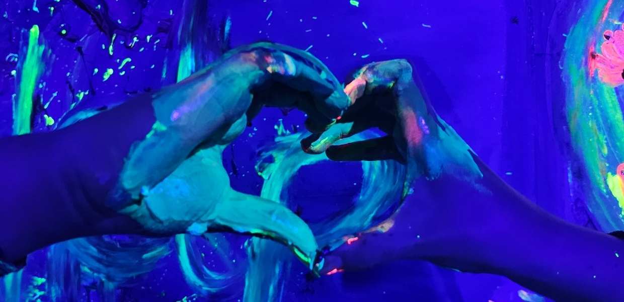 Neon Heart Shape in hands