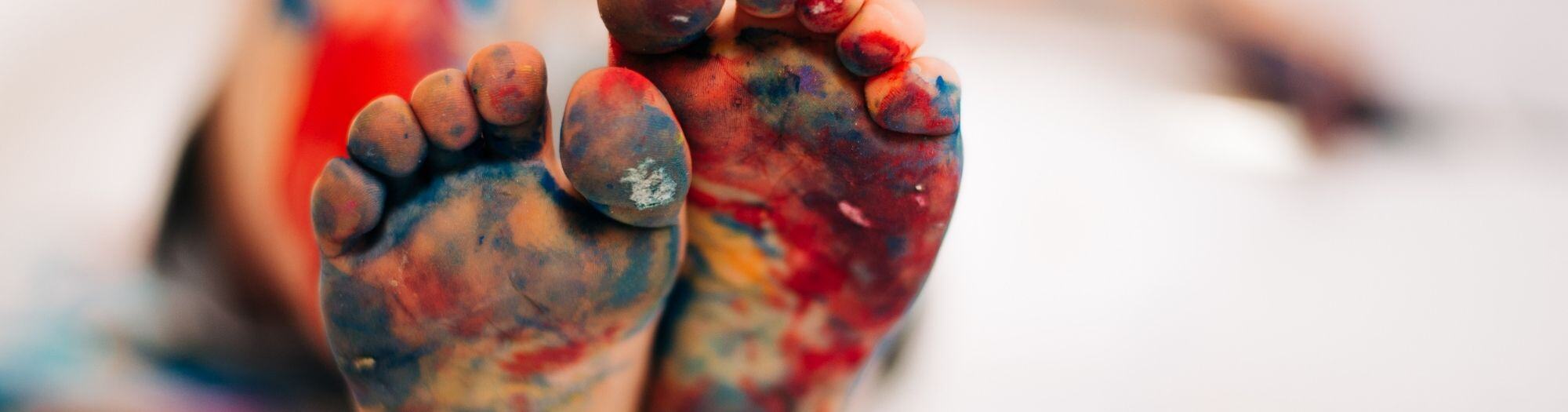 Kids Feet Covered With paint