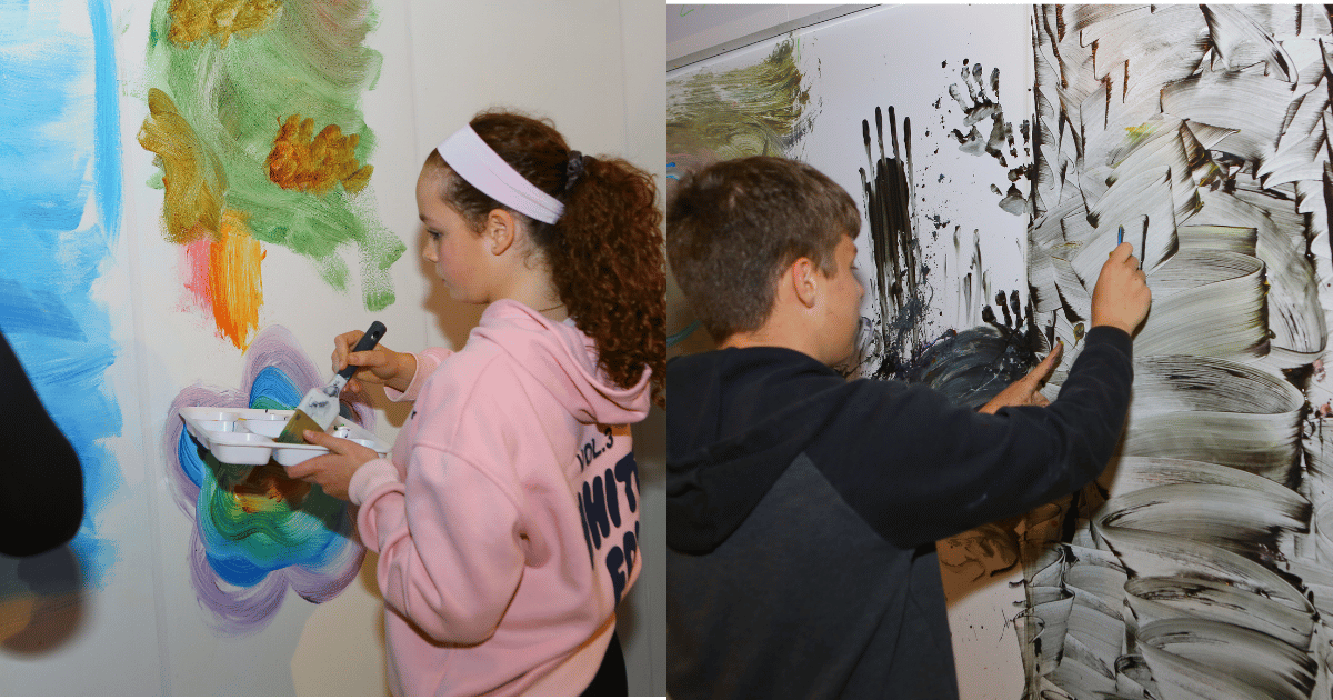 Boy and Girl painting at Teen Neon Paint Night