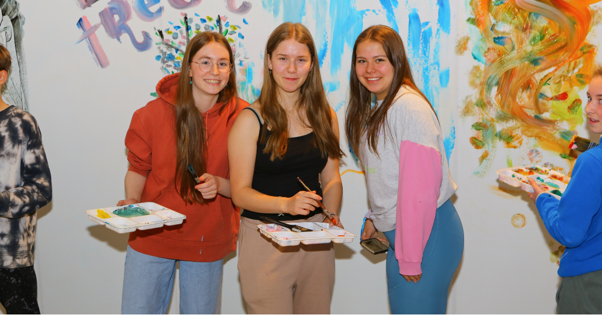 Three girls at Teen Neon Paint Night