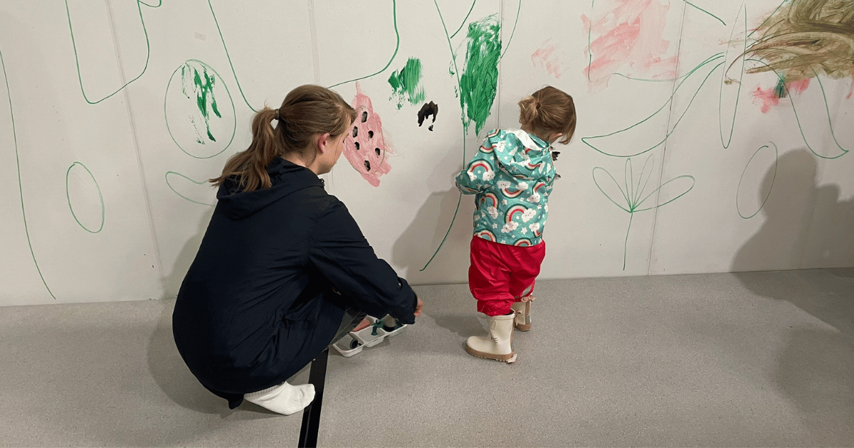 Toddler Paint mum and girl painting on the wall
