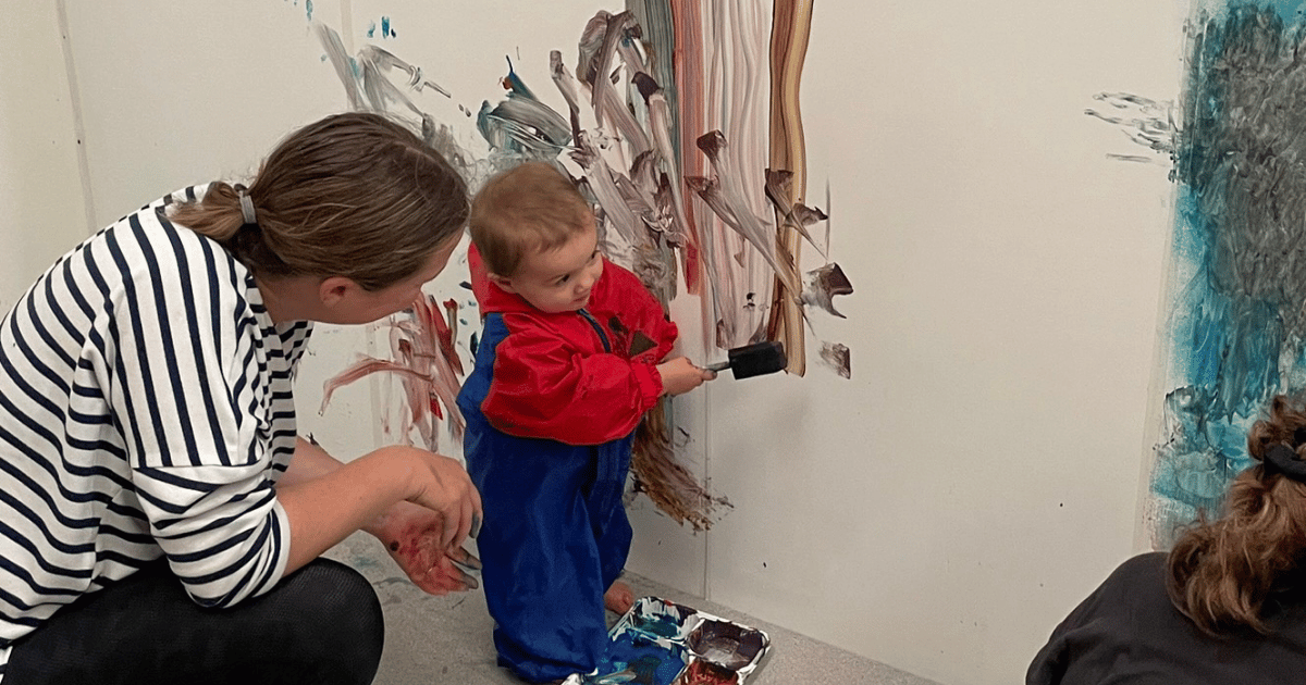 Toddler Paint mum helping her little boy